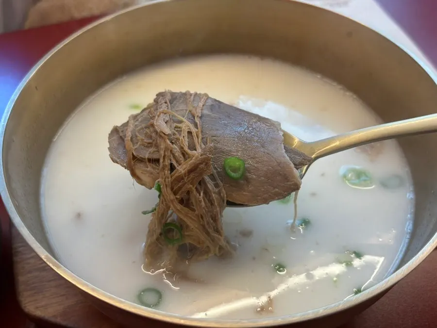 Rice served separately alongside the bone broth