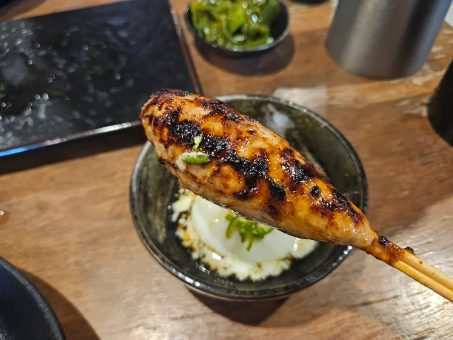Egg yolk served alongside the tsukune