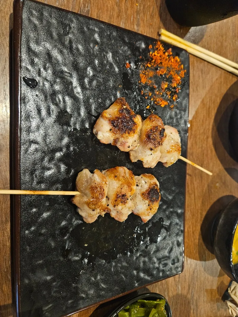 Round pieces of gizzard threaded on a skewer