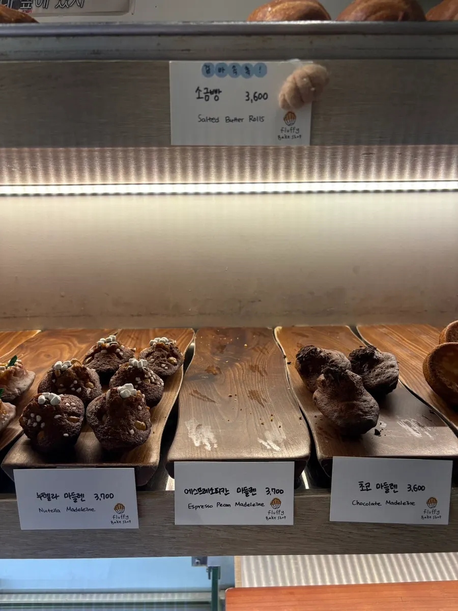 Canelés and other baked goods on display