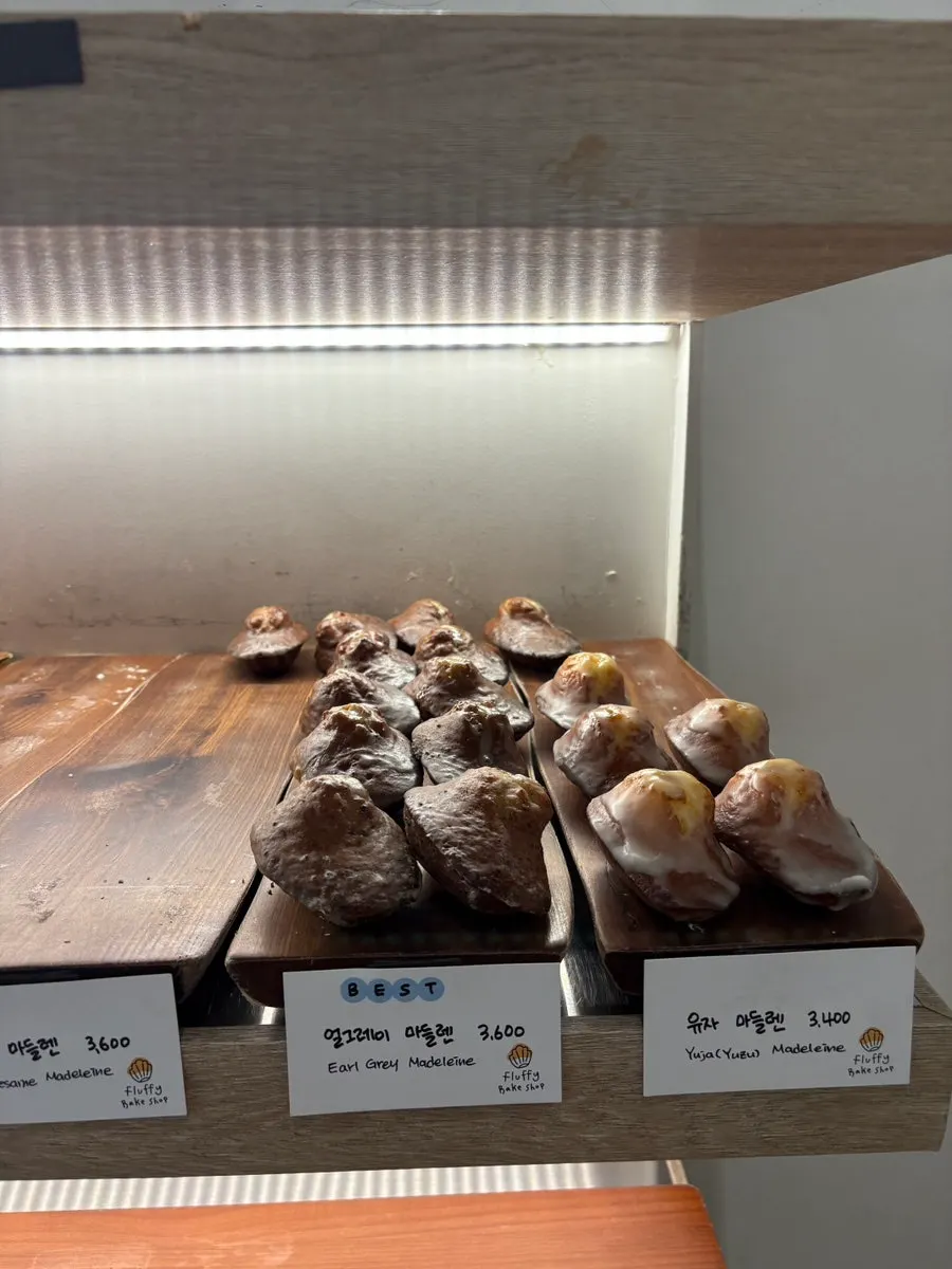 Shelf with madeleines arranged by flavor