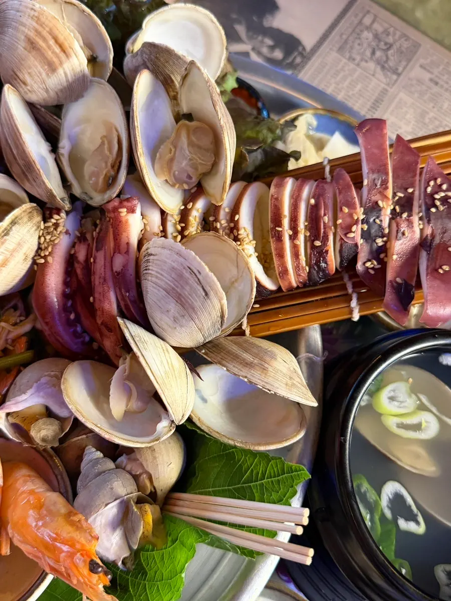 Seafood platter with whole sea snails and squid
