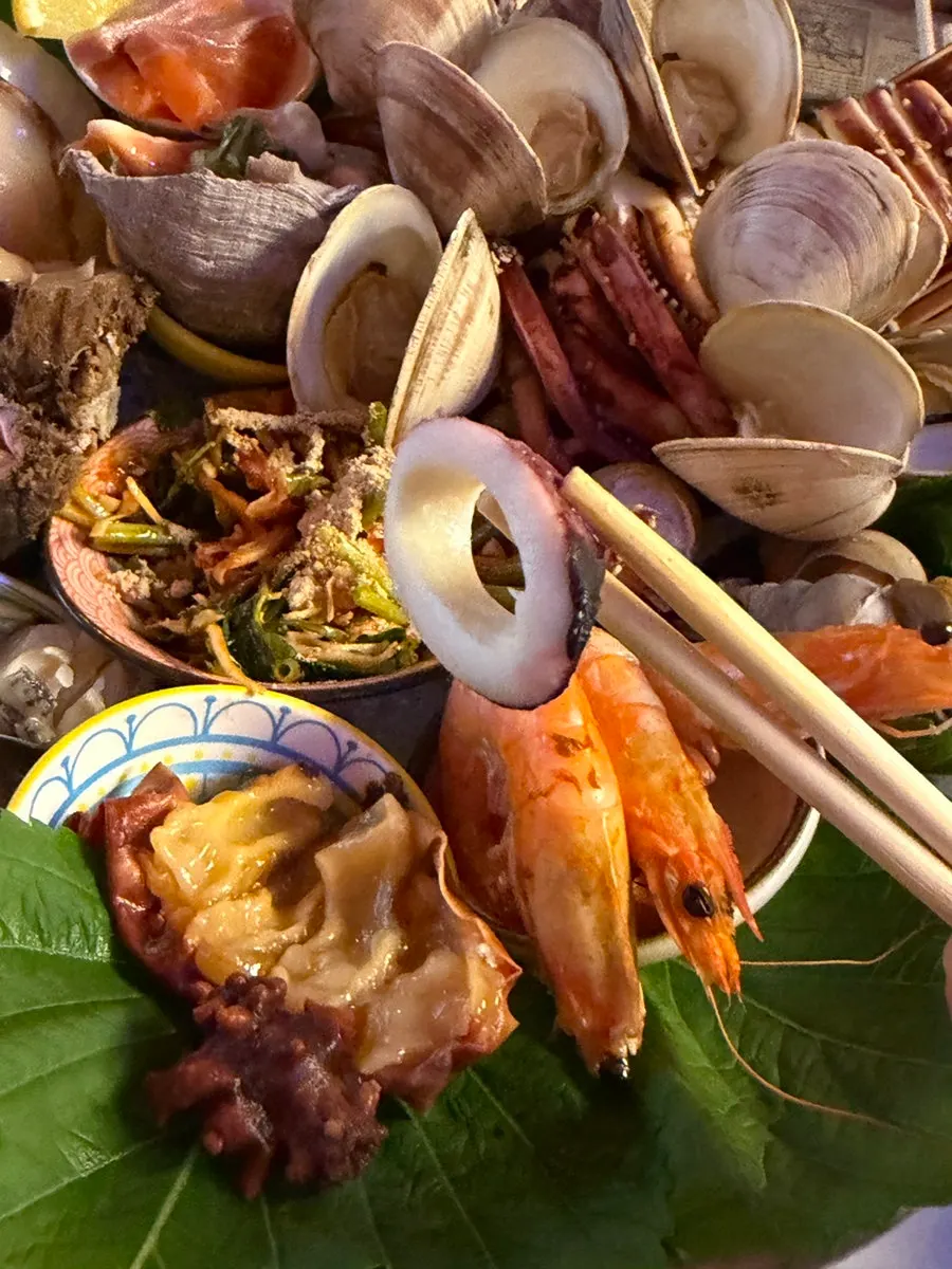 Whelk meat pulled out with a toothpick
