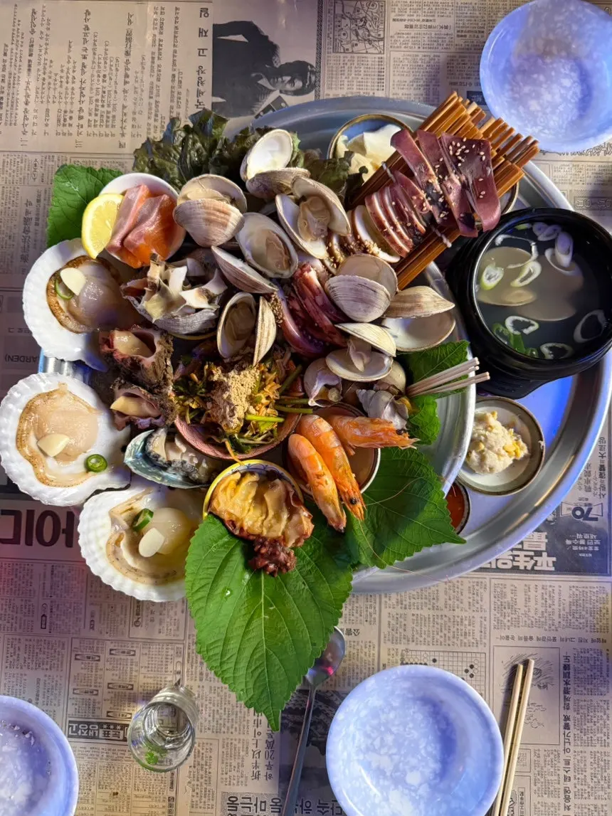 Table piled with leftover seafood shells