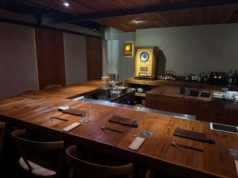 Counter seating under warm wood-toned lighting