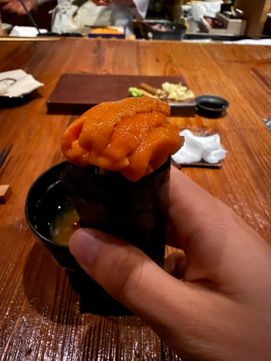 Negitoro maki topped with sea urchin roe