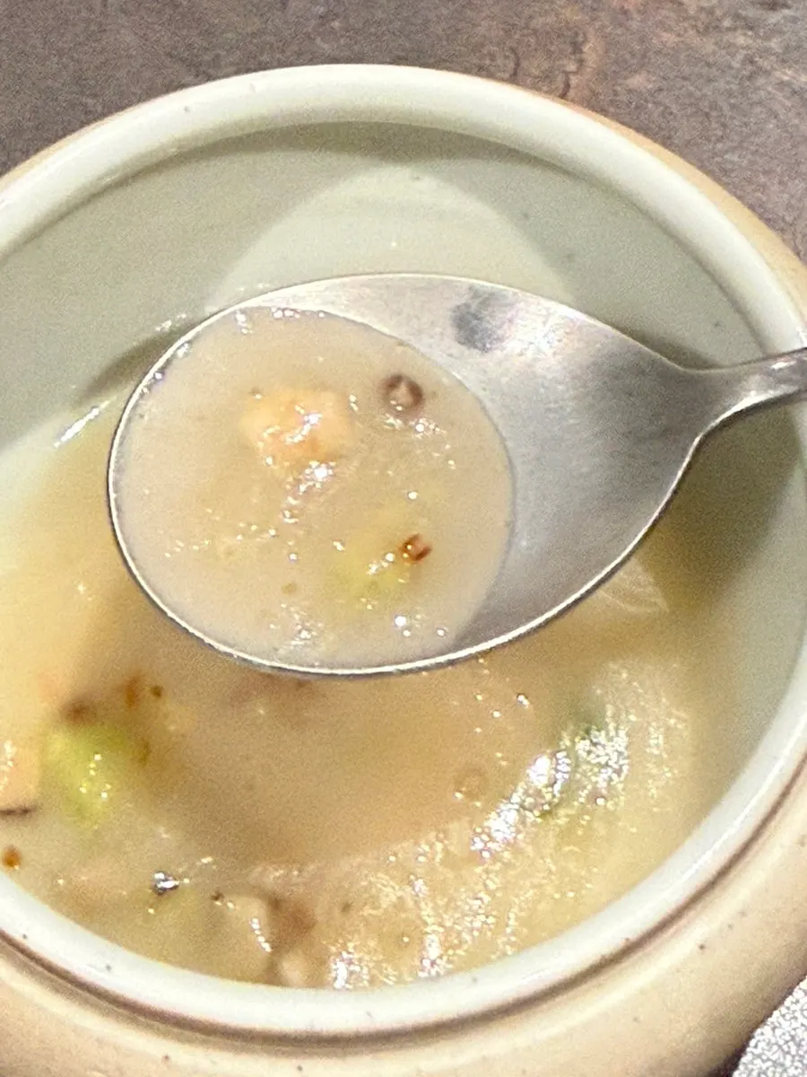 Jin-juk porridge topped with nurungji and mushroom garnish