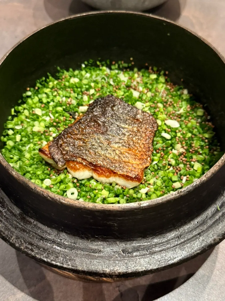 Seasonal fish pot rice shown before serving