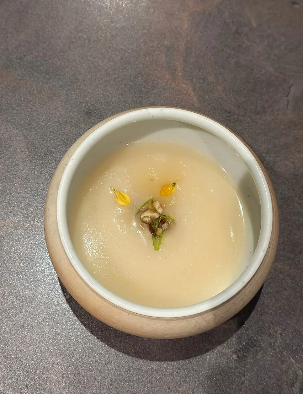A bowl of porridge made with hanwoo bone broth and chicken stock
