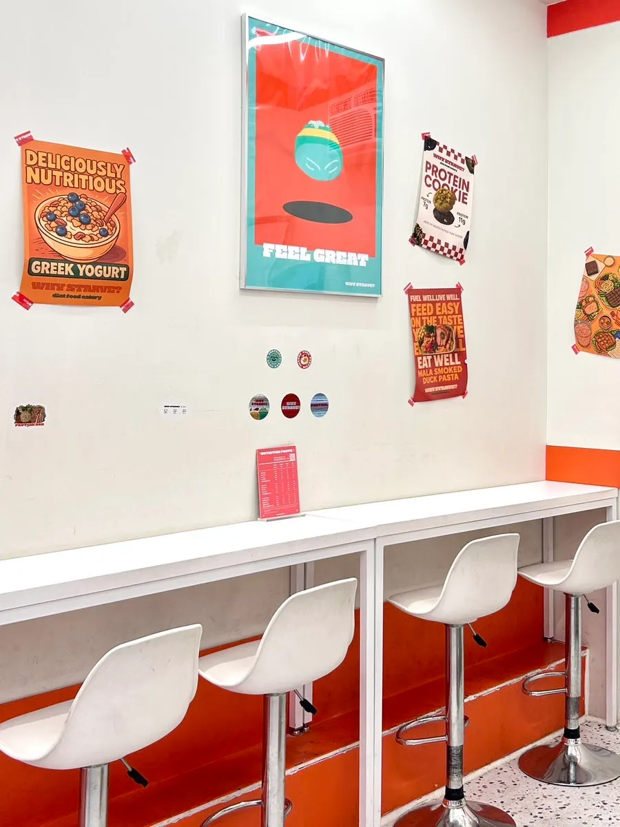 Clean store interior with tables for solo dining