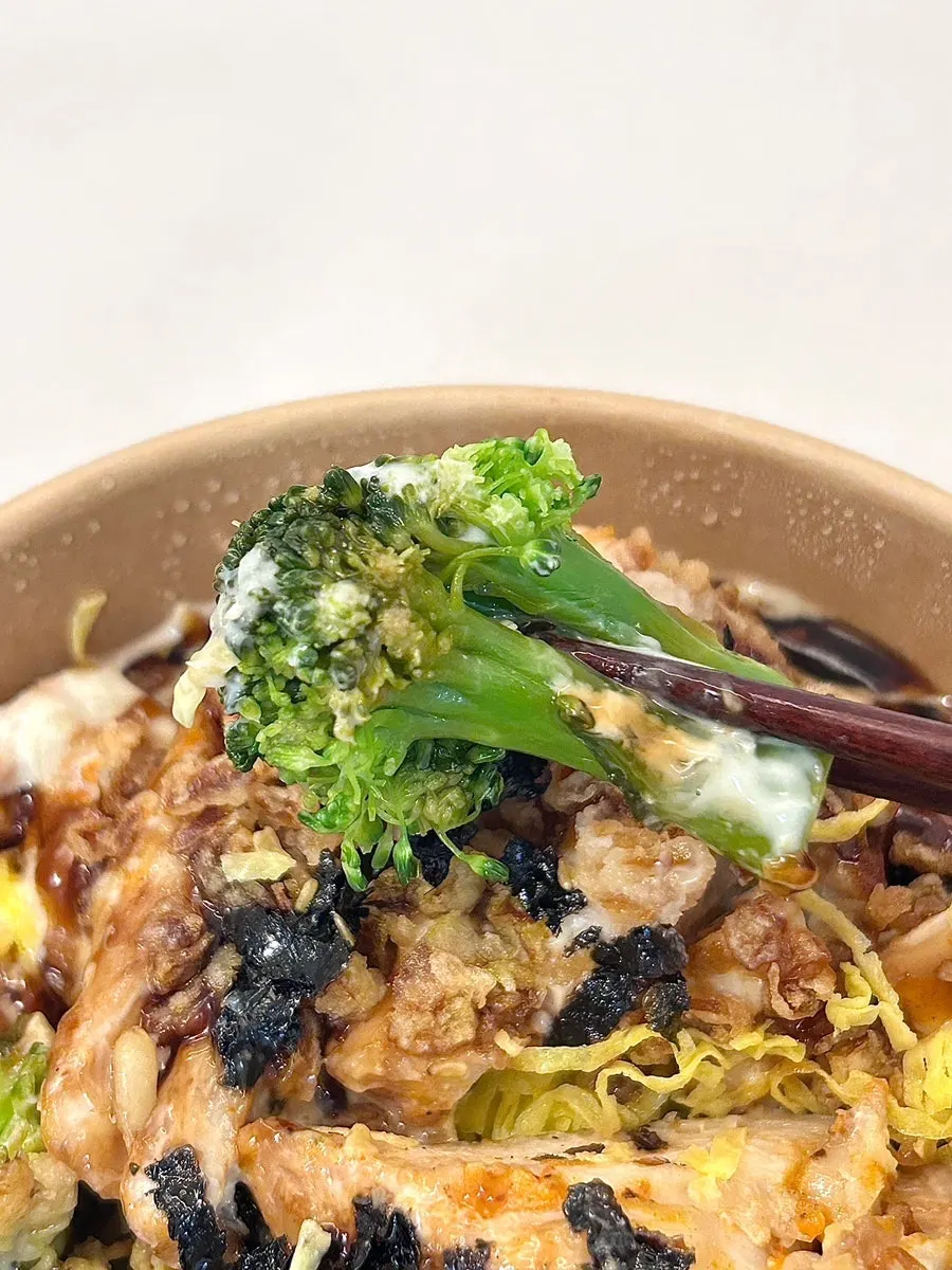 Close-up of chicken rice bowl with teriyaki sauce