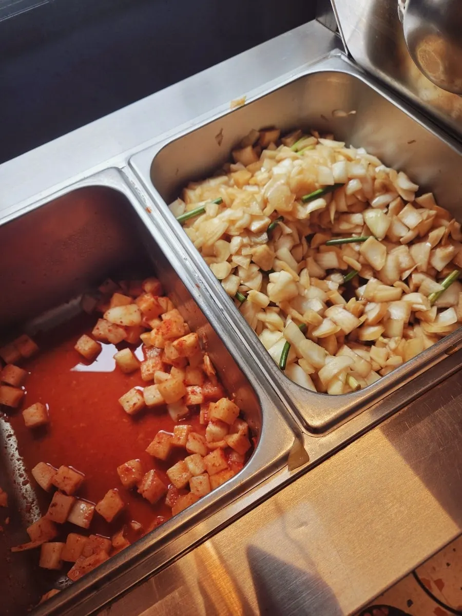 Self-serve bar with kkakdugi and onions