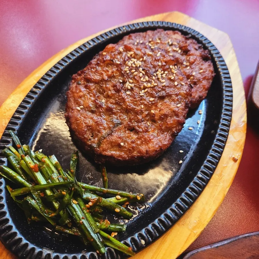 Juicy tteokgalbi on a hot plate