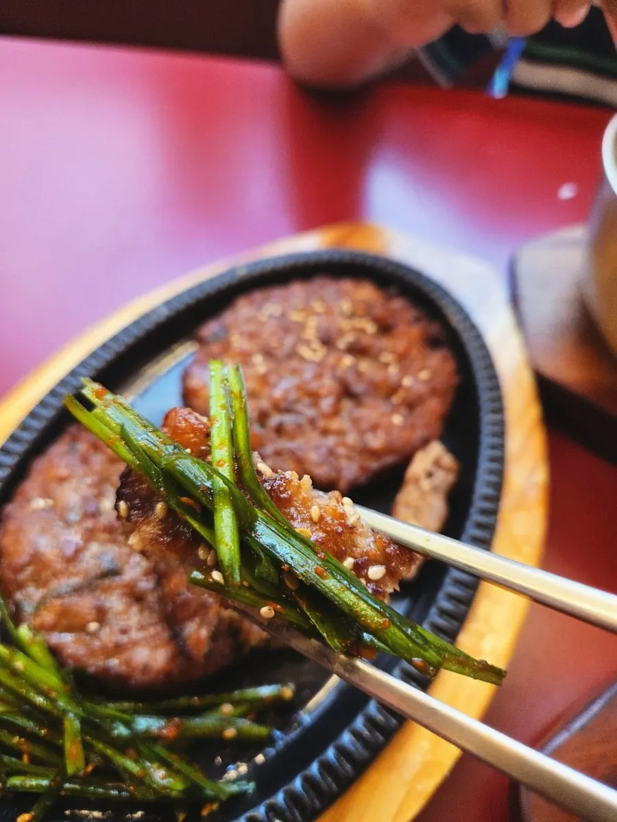 Tteokgalbi paired with chive salad