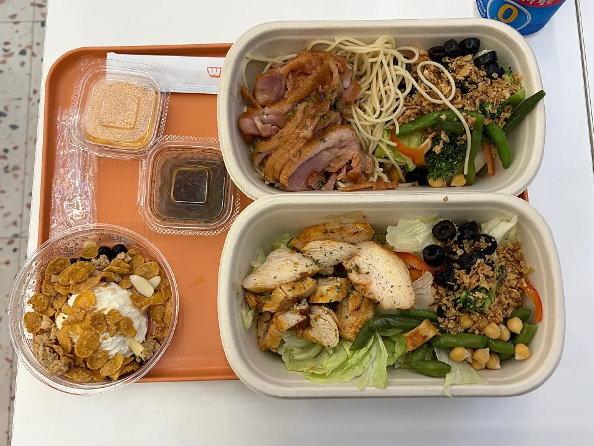 Two freshly made Why Starve salad boxes