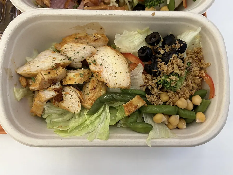 Light chicken salad topped with chicken breast
