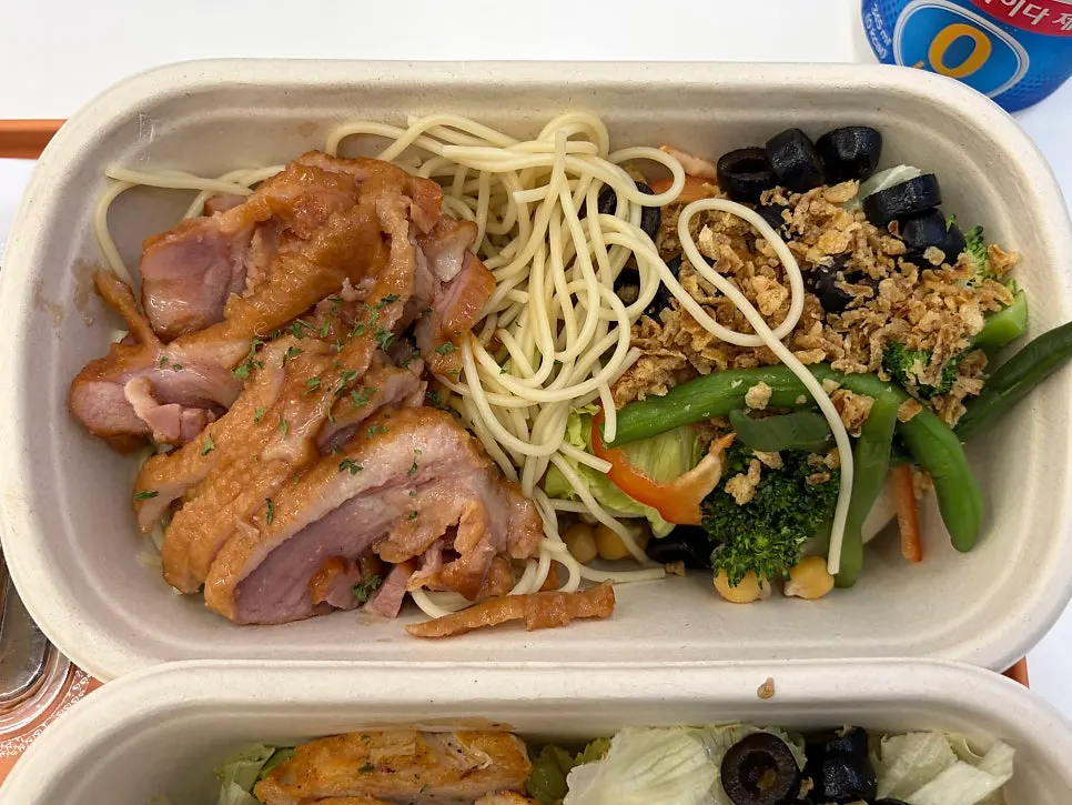 Mala pasta box topped with smoked duck