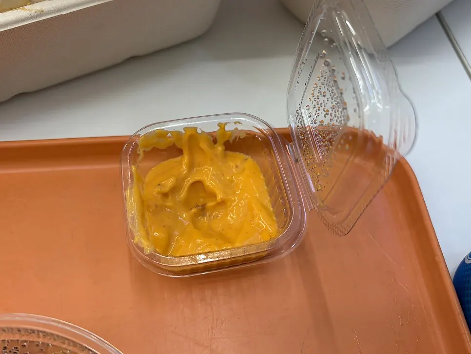 Oriental and sriracha mayo sauces served separately