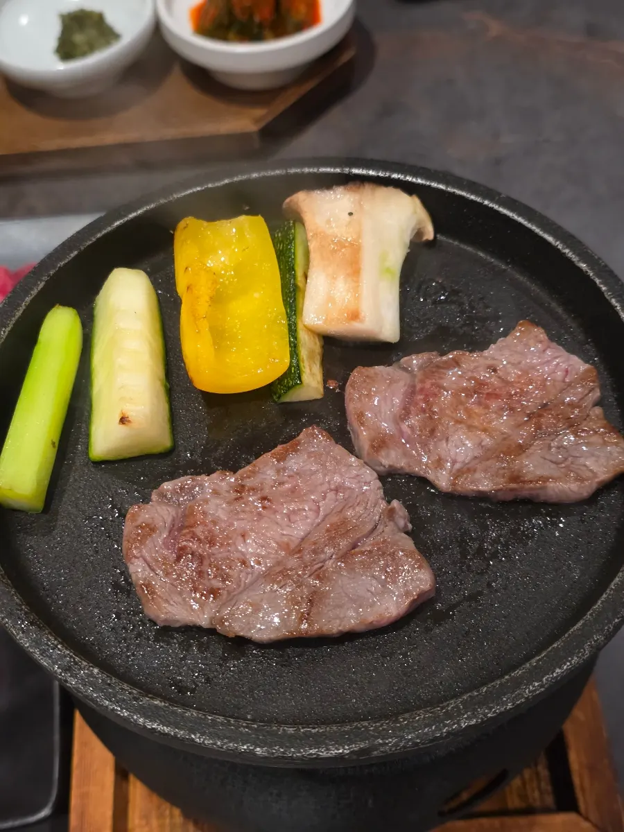1++ hanwoo sirloin grilling on the charcoal brazier