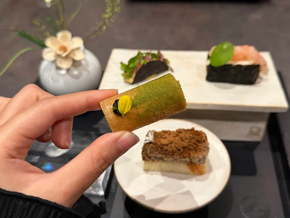 Scallop and clam bite dish served on pastry