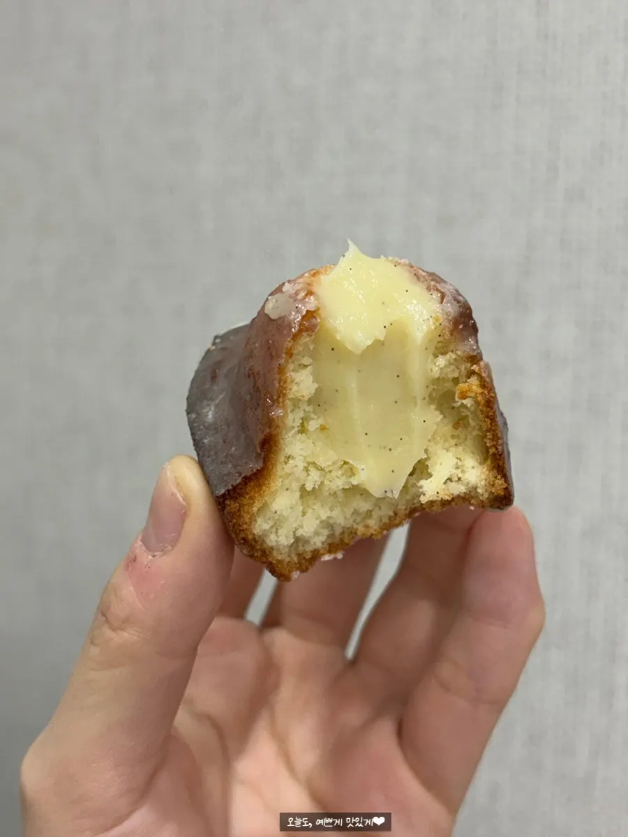 Vanilla madeleine with visible vanilla bean flecks