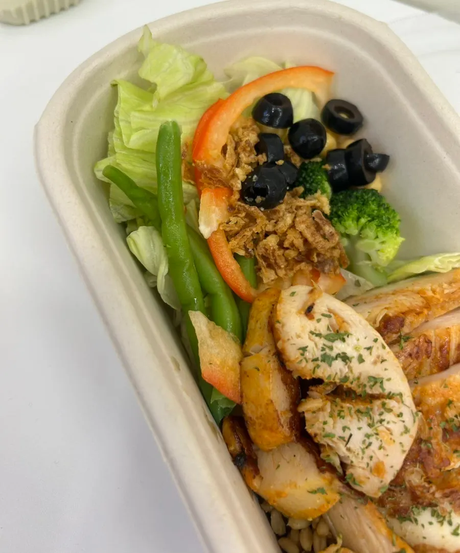 Protein box containing oat rice and grilled chicken breast
