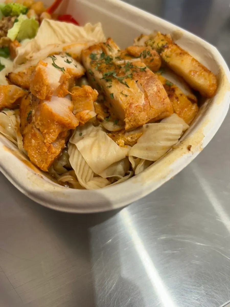Tofu noodles layered underneath the chicken breast