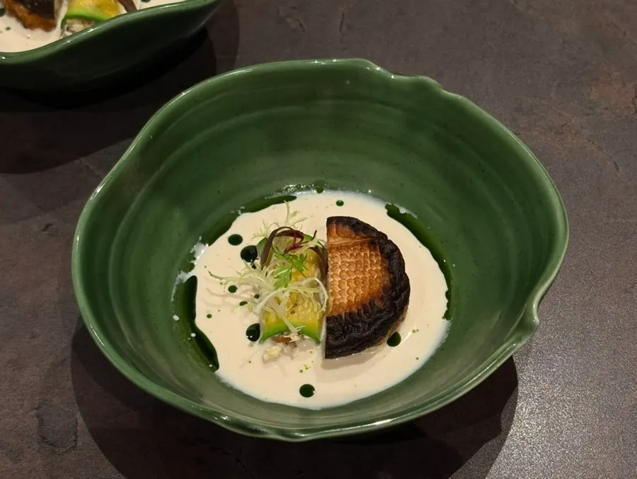 Plated course dish combining shiitake and shrimp