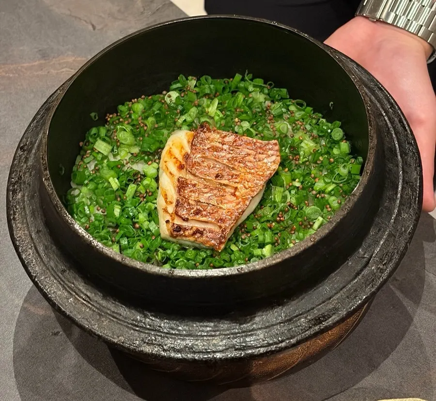 Seasonal fish pot rice shown before being portioned out