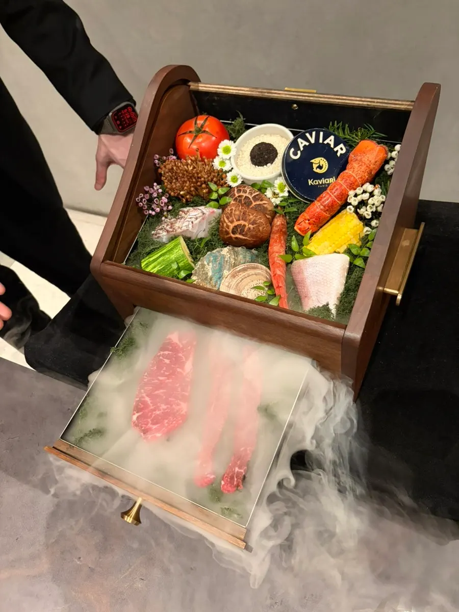 A showing box filled with seasonal ingredients for the course