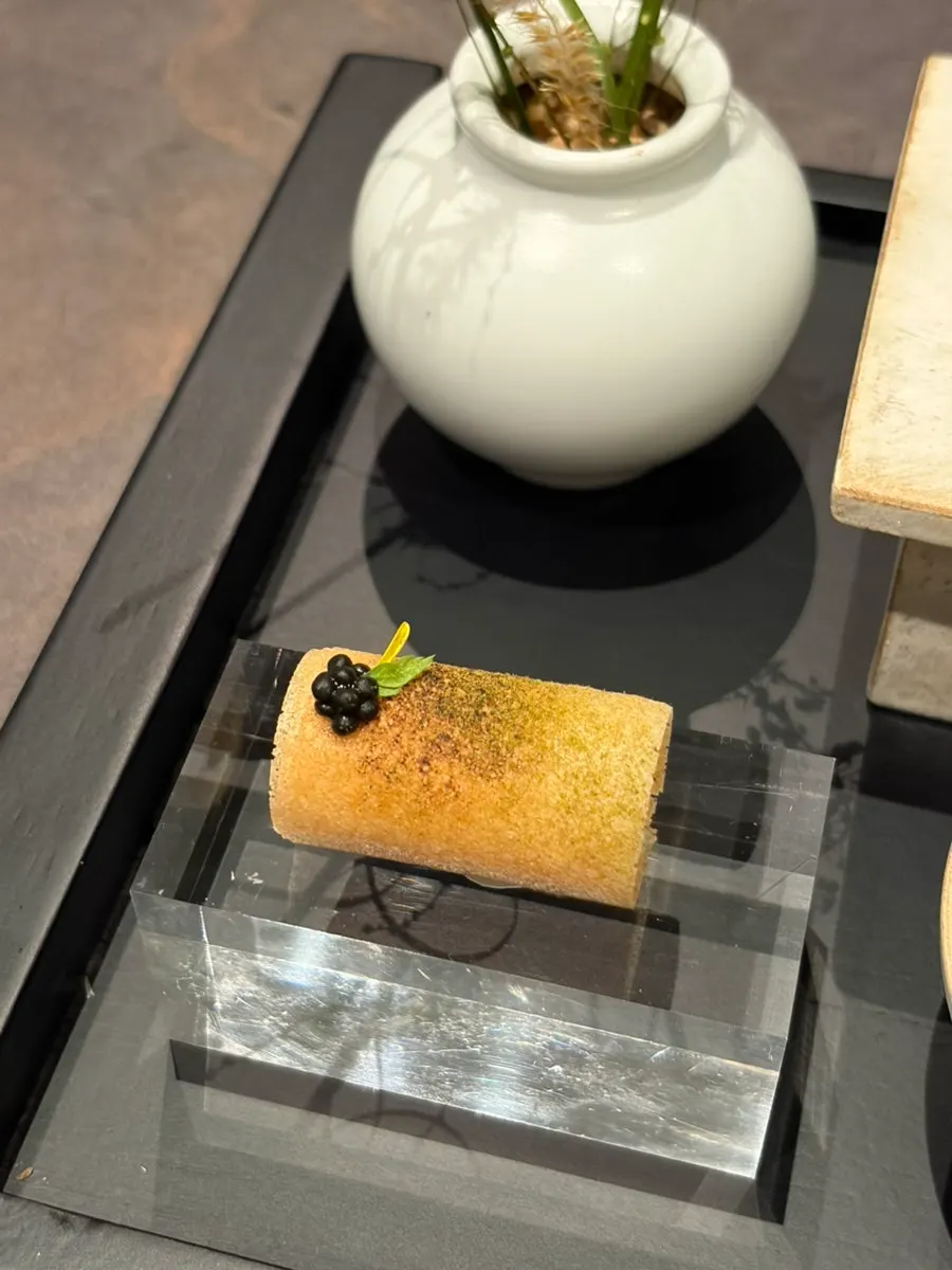 Four neatly plated bite-sized dishes