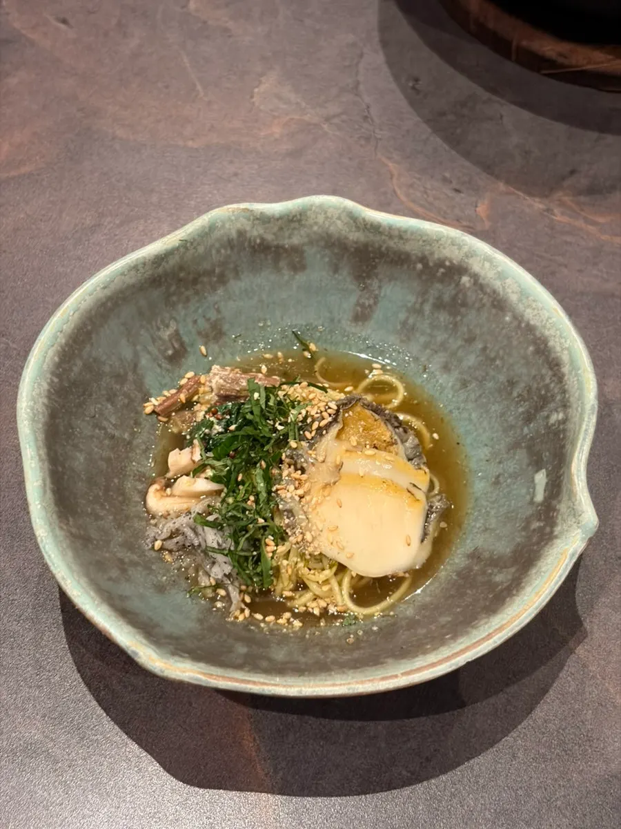 The seasonal fish pot rice shown briefly for photos