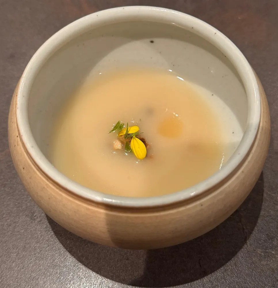 U-gye jinjuk porridge served in a ceramic bowl