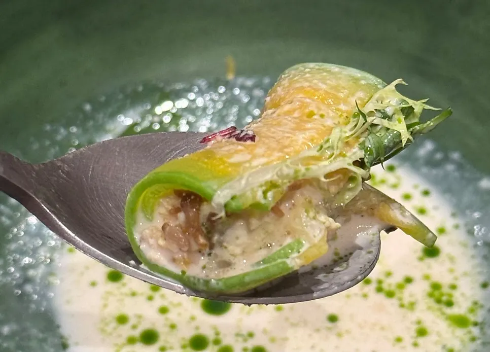 Cross-section of the zucchini roll filled with tofu and aged kimchi