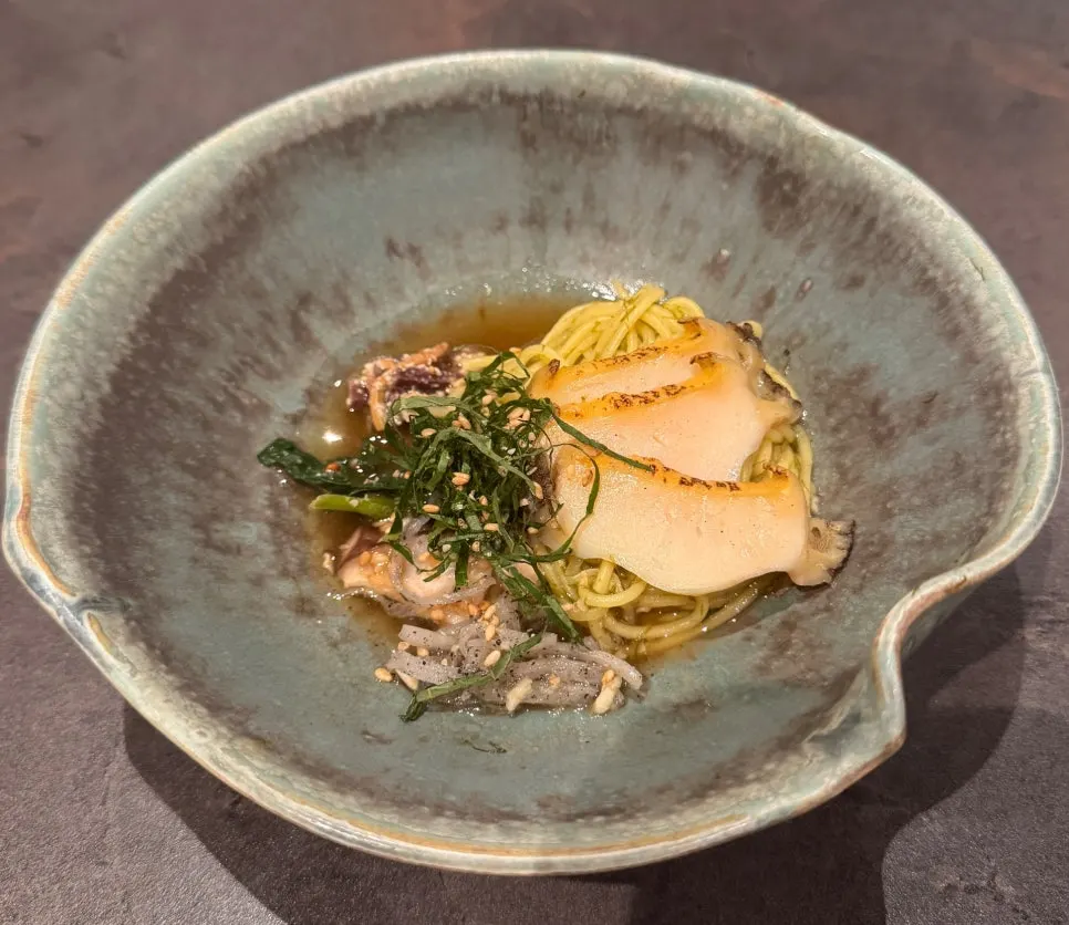 Abalone five-color gardenia noodles served in a ceramic bowl