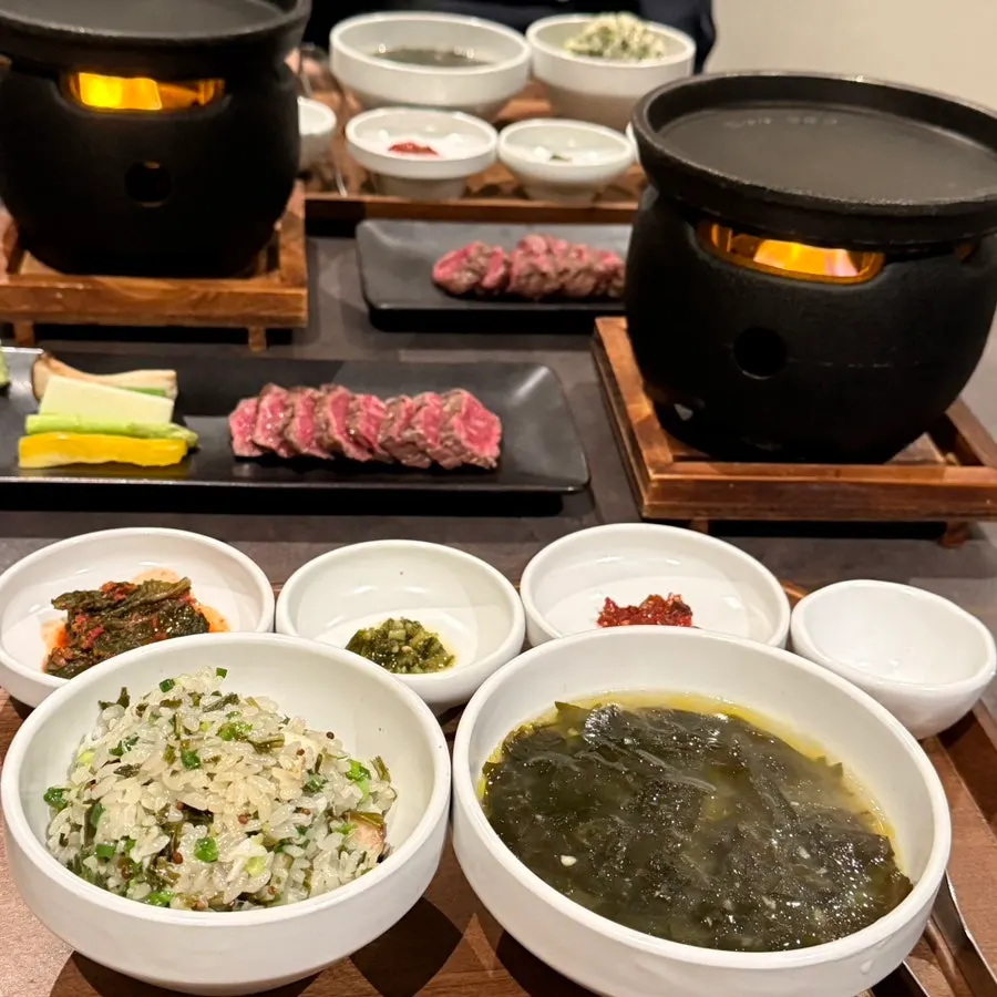 Table setting with 1++ sirloin and hanwoo seaweed soup