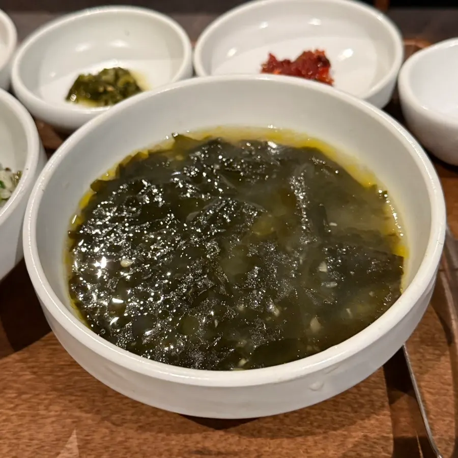 Table setting with pot rice and side dishes