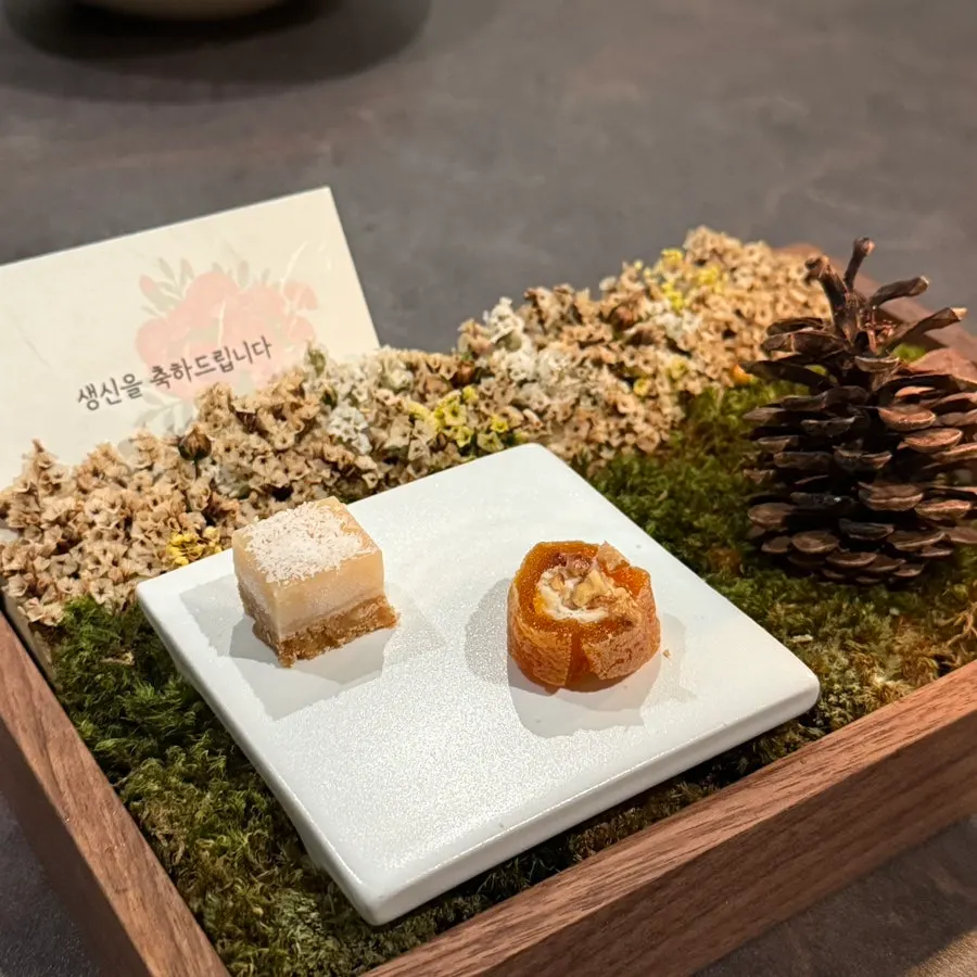 Corn ice cream and black sponge cake dessert