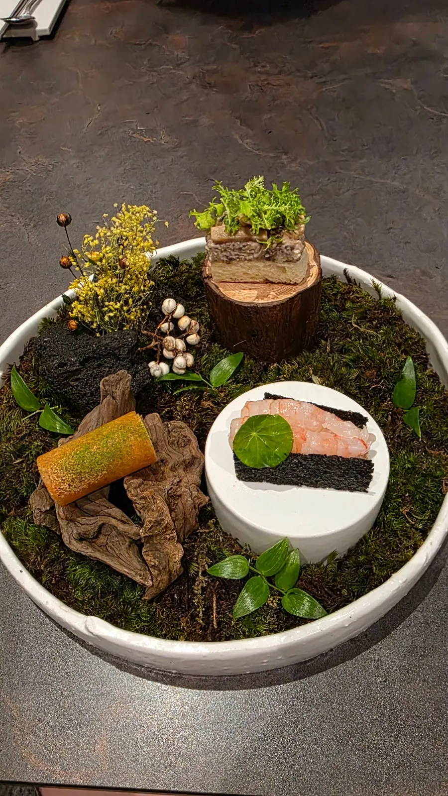 Plating of three bite-sized dishes styled as a forest