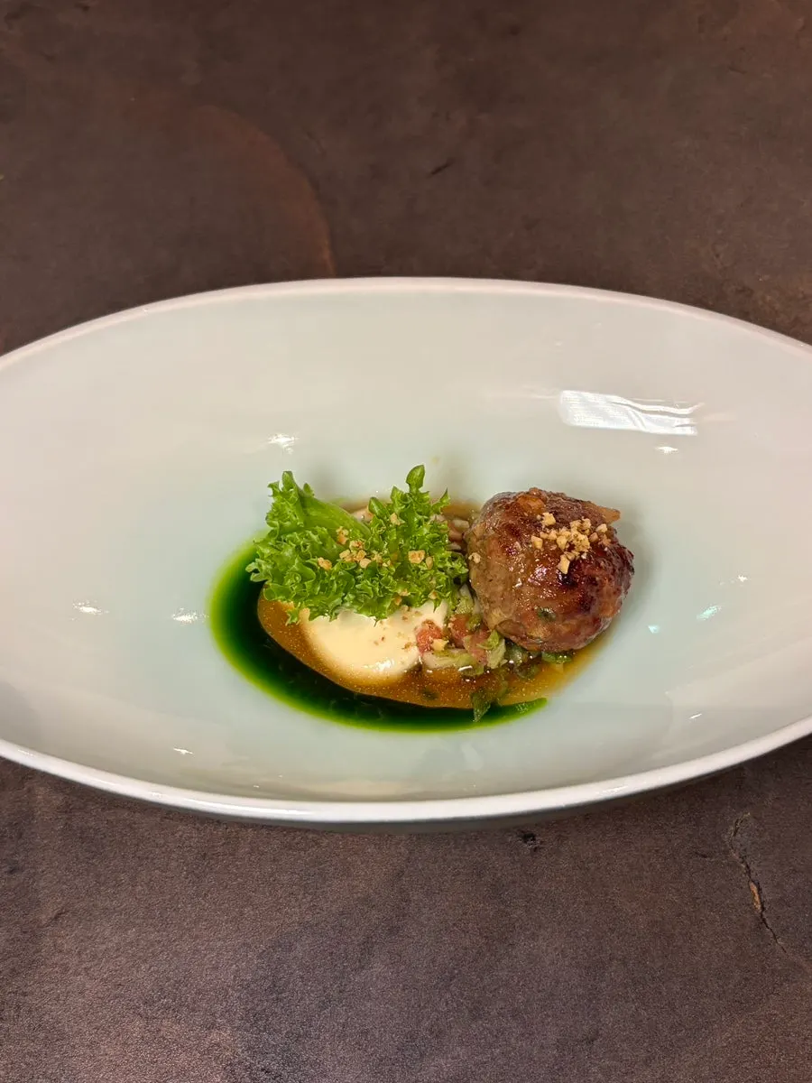 A mid-course dish being served