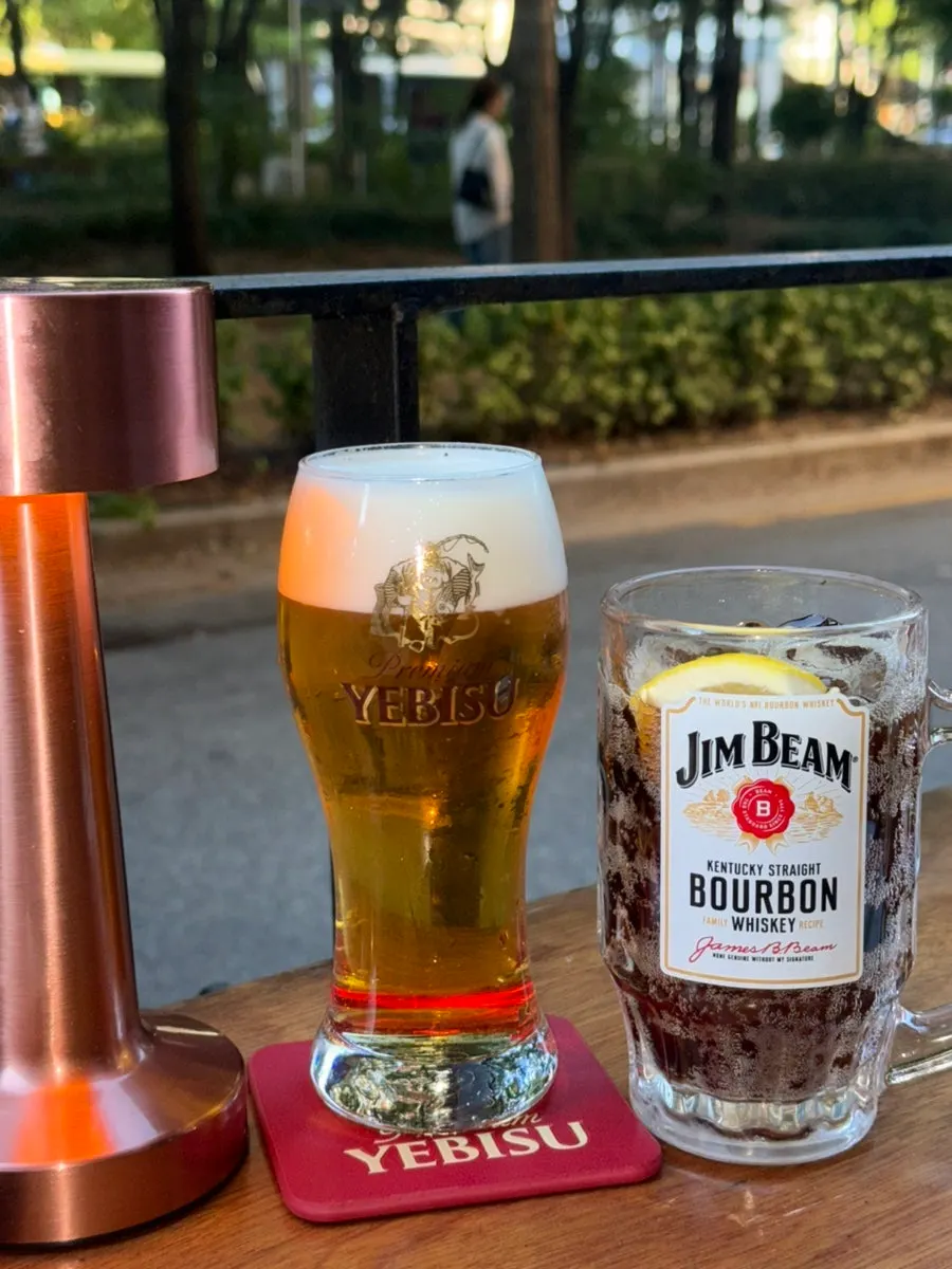 Cold draft beer ordered with the yakitori