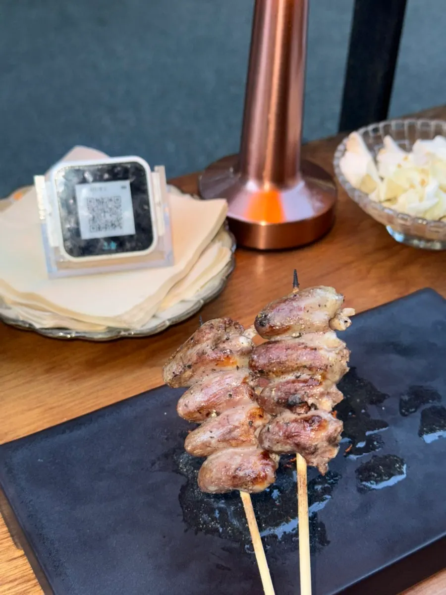 Close-up of the charcoal-grilled heart skewer