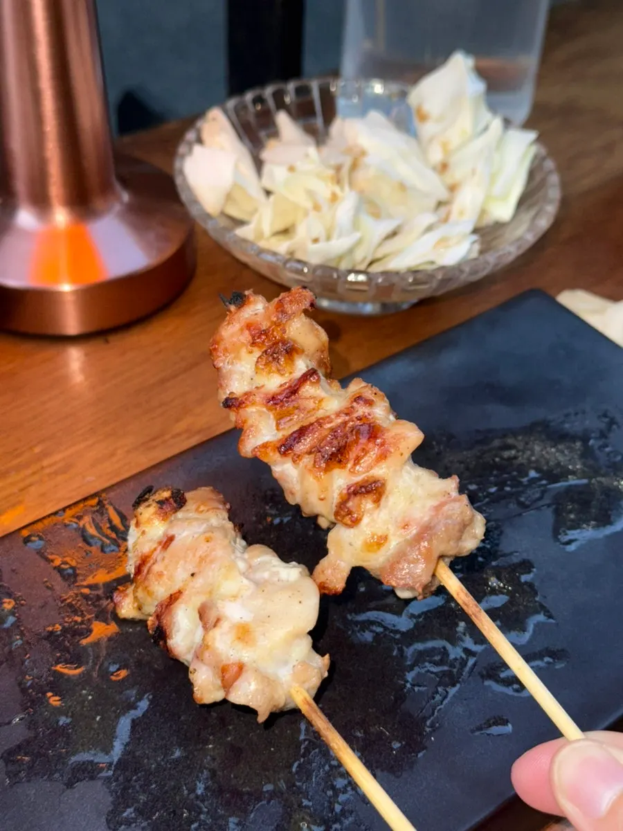 Close-up of the seasoned chicken shoulder skewer