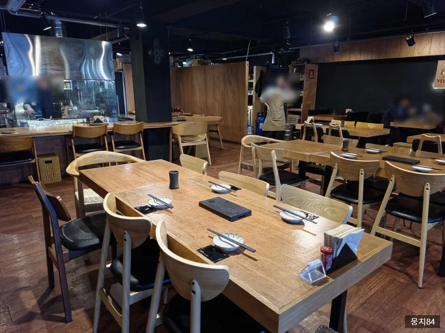Spacious dimly lit indoor hall at Yakitori Shomong
