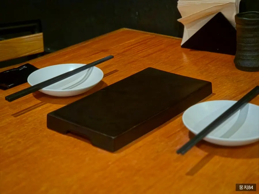Neatly arranged basic table setting at Yakitori Shomong