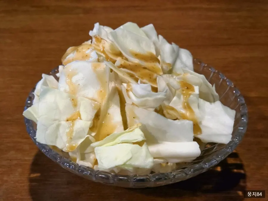 Complimentary cabbage with sauce served as a starter