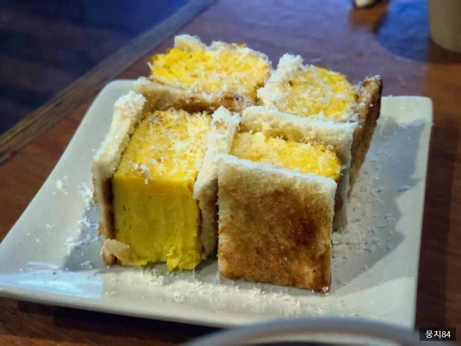 Osaka-style tamago sando with a whole dashimaki inside