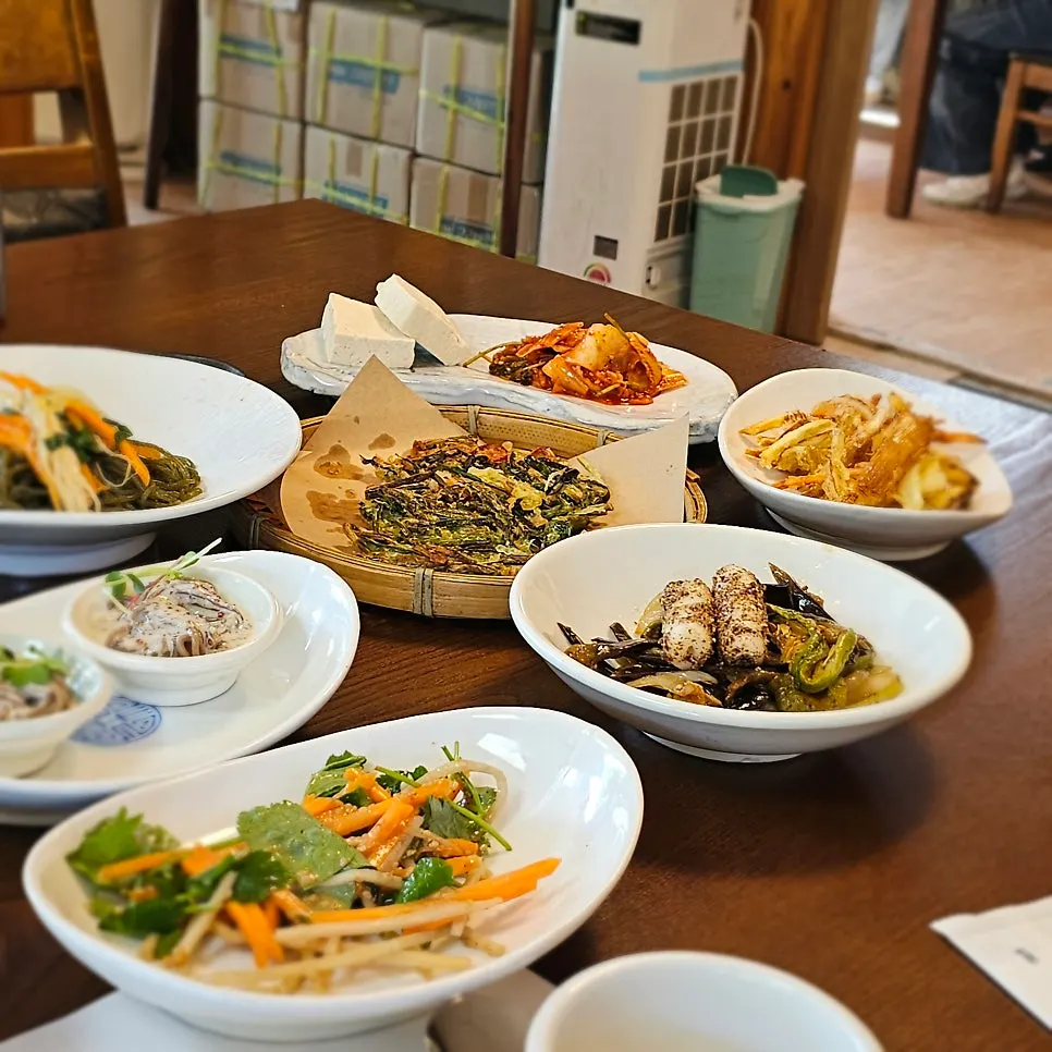 Table filled with an array of side dishes