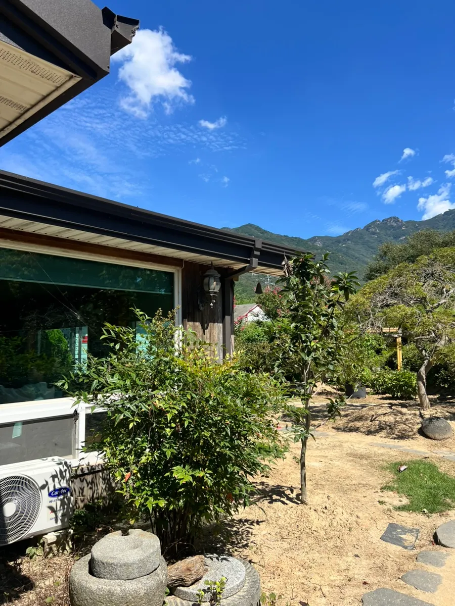 View of the Bapkkot Hana Pieotne entrance at the end of a country road