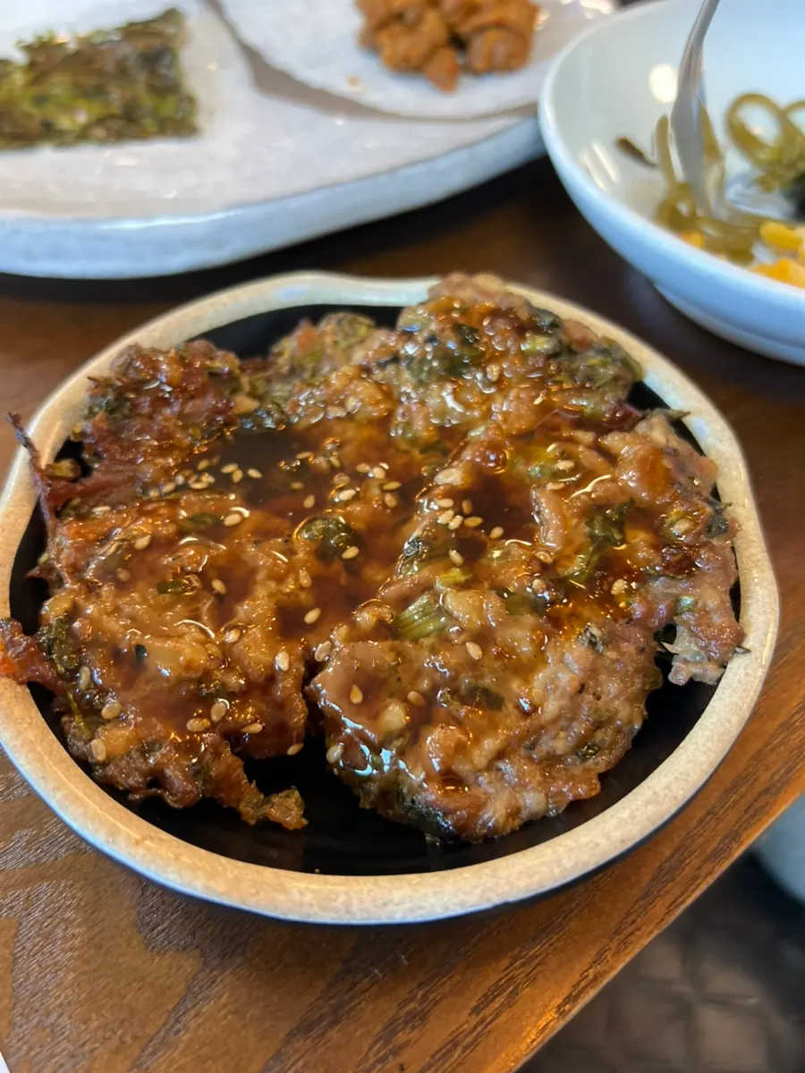 A plate of minari tteokgalbi